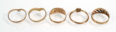 Lot 651 - Five 9ct yellow gold rings including two...