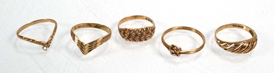 Lot 651 - Five 9ct yellow gold rings including two...