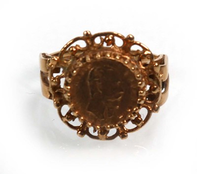 Lot 652 - A 9ct yellow gold ring decorated with a...