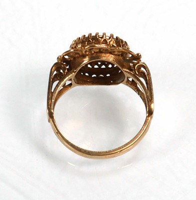Lot 652 - A 9ct yellow gold ring decorated with a...