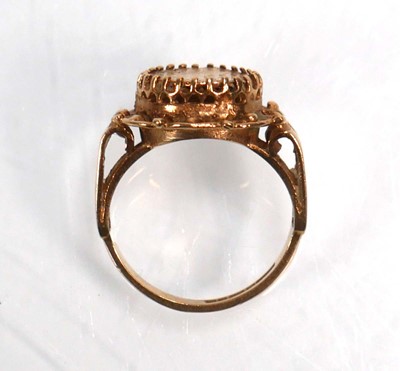Lot 652 - A 9ct yellow gold ring decorated with a...