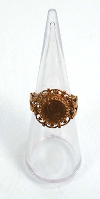 Lot 652 - A 9ct yellow gold ring decorated with a...