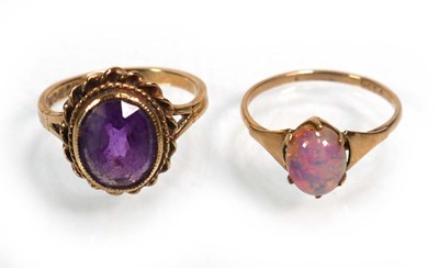 Lot 654 - A 9ct yellow gold ring set opal type stone,...