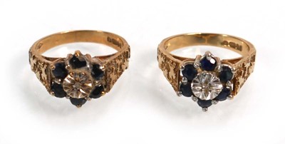 Lot 655 - A pair of 9ct yellow gold cluster rings set...