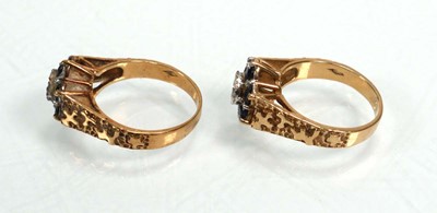 Lot 655 - A pair of 9ct yellow gold cluster rings set...