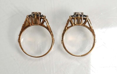 Lot 655 - A pair of 9ct yellow gold cluster rings set...