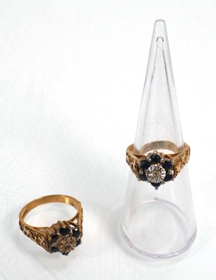 Lot 655 - A pair of 9ct yellow gold cluster rings set...