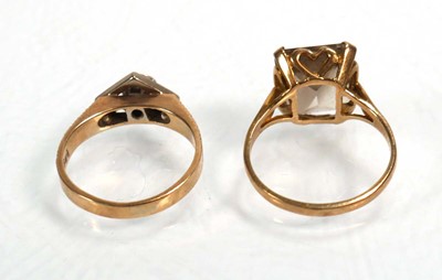 Lot 656 - A 9ct yellow gold ring set smoky quartz, ring...