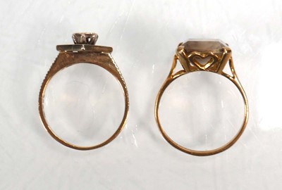 Lot 656 - A 9ct yellow gold ring set smoky quartz, ring...
