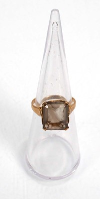 Lot 656 - A 9ct yellow gold ring set smoky quartz, ring...