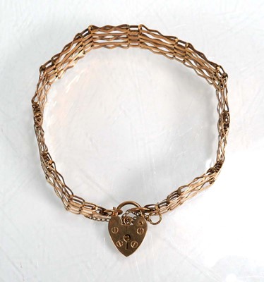 Lot 659 - A 9ct yellow gold five bar gatelink bracelet...