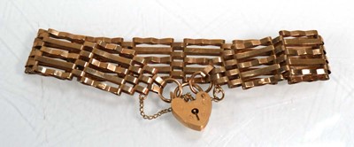 Lot 659 - A 9ct yellow gold five bar gatelink bracelet...