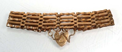 Lot 659 - A 9ct yellow gold five bar gatelink bracelet...