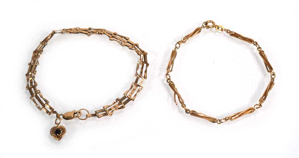 Lot 663 - A 9ct yellow gold three bar gatelink bracelet...