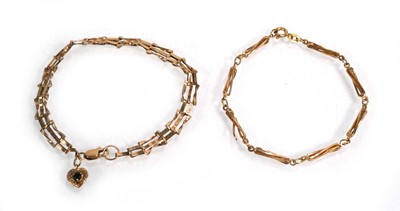 Lot 663 - A 9ct yellow gold three bar gatelink bracelet...