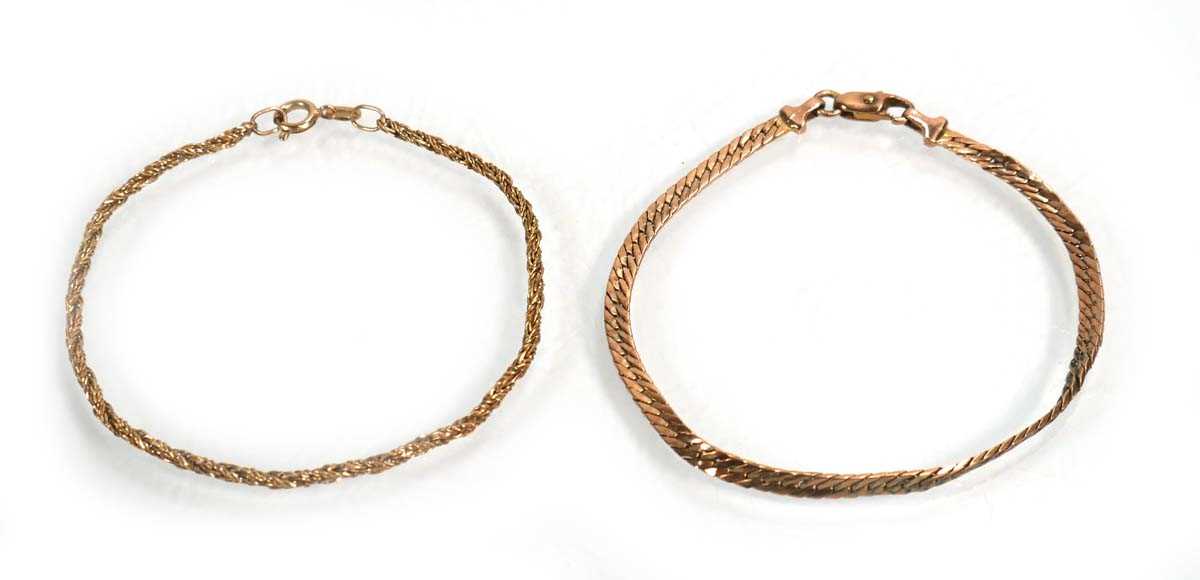 Lot 664 - A 9ct yellow gold flat curblink bracelet with...