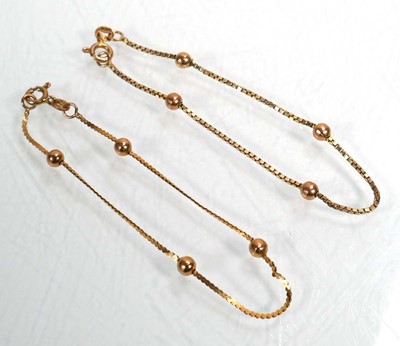 Lot 666 - A pair of 9ct yellow gold box and ball link...