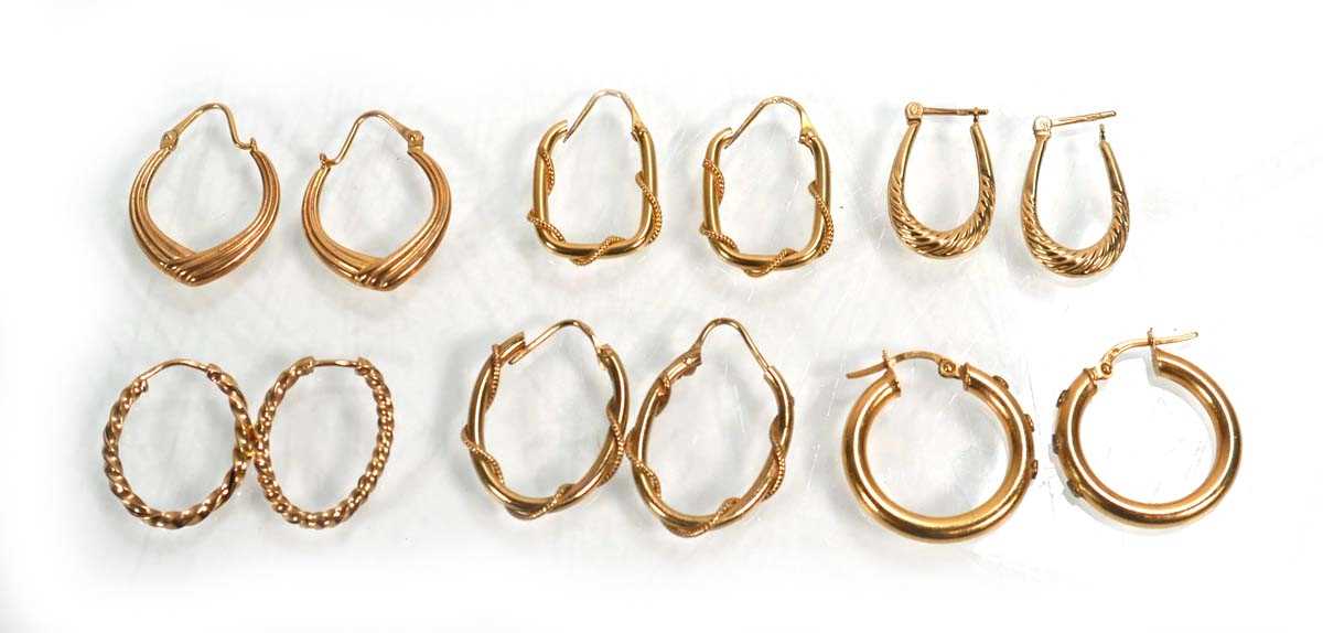 Lot 668 - Six pairs of 9ct yellow gold hoop earrings,...