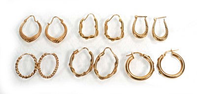 Lot 668 - Six pairs of 9ct yellow gold hoop earrings,...