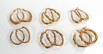 Lot 668 - Six pairs of 9ct yellow gold hoop earrings,...