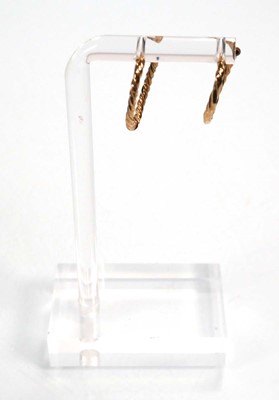 Lot 668 - Six pairs of 9ct yellow gold hoop earrings,...