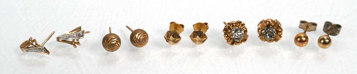 Lot 670 - Five pairs of 9ct yellow gold ear studs,...