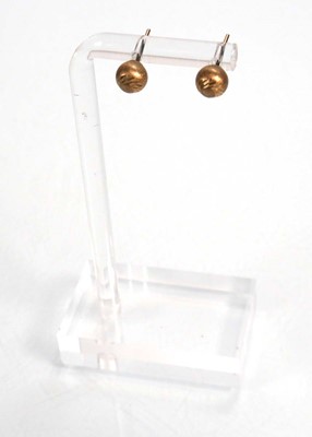 Lot 670 - Five pairs of 9ct yellow gold ear studs,...