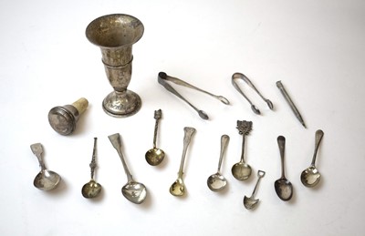 Lot 333 - A group of silver spoons and tongs, including...