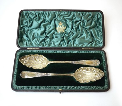 Lot 335 - A pair of George III silver gilt berry spoons,...