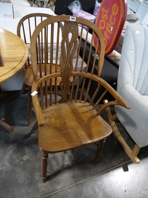Lot 1063 - Wooden spindle back armchair and similar...