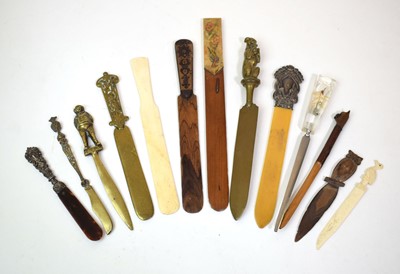 Lot 142 - A group of letter openers including two silver...