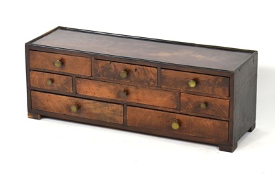 Lot 31 - A 19th century mahogany bank of eight drawers,...