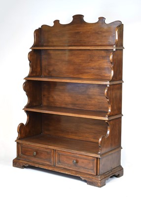 Lot 42 - A 20th century mahogany 'waterfall' bookcase,...