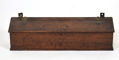 Lot 43 - A Georgian oak candle box, 53 x 13 x 14 cm