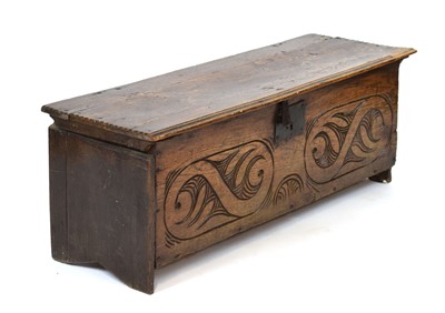 Lot 49 - An 18th century oak hutch with later carving...