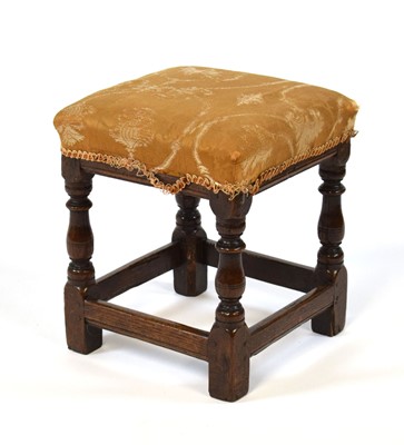 Lot 53 - An 18th century oak stool with later...