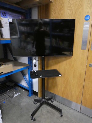Lot 2185 - Samsung 43" TV on stand with remote, model...