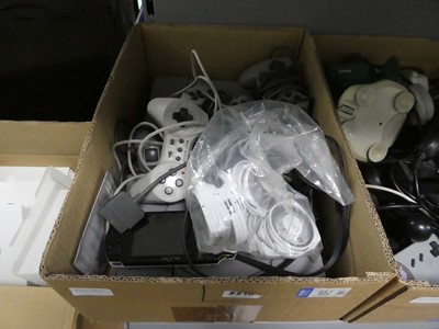 Lot 2216 - Two Sony PlayStations along with a Sony PSP...
