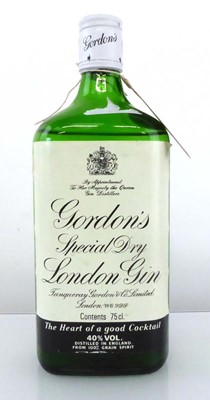 Lot 143 - An old bottle of Gordon's Special Dry London...