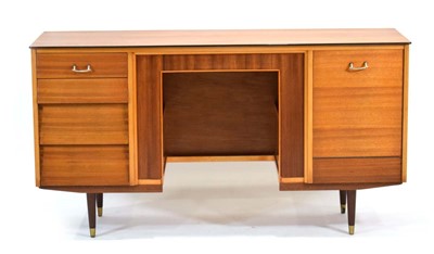 Lot 112 - A 1960's walnut desk with a fall front and...