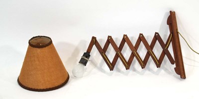Lot 167 - A 1960's Danish teak concertina wall arm light...