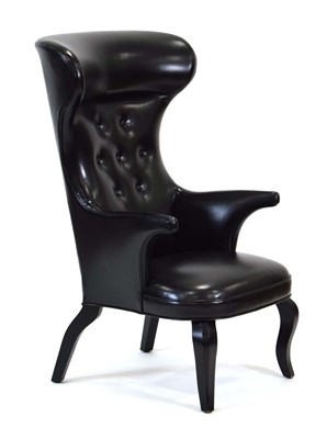 Lot 275 - A contemporary black button upholstered...