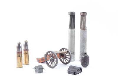 Lot 1124 - an assortment of militaria including inert...