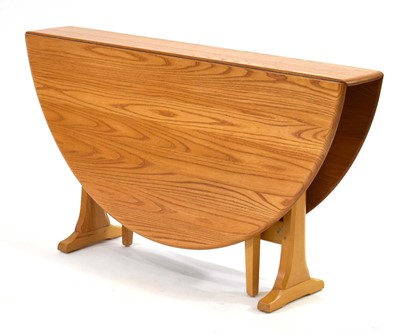 Lot 297 - An Ercol elm gateleg 'Burnham' table, Model...