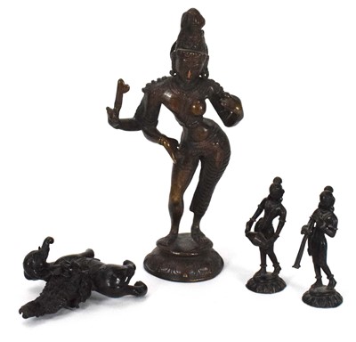 Lot 115 - An Indian brown-patinated cast metal figure...