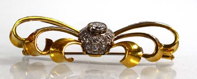 Lot 671 - An 18ct yellow gold brooch of bow design...