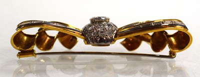 Lot 671 - An 18ct yellow gold brooch of bow design...