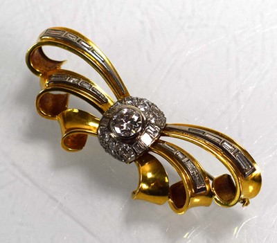Lot 671 - An 18ct yellow gold brooch of bow design...