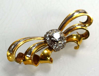 Lot 671 - An 18ct yellow gold brooch of bow design...