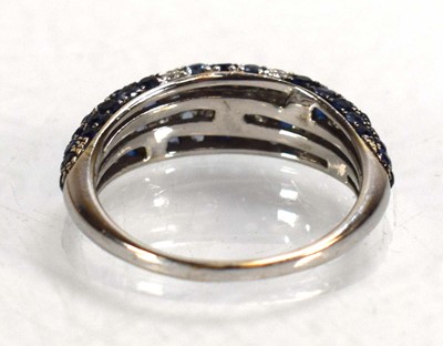 Lot 674 - A 14ct white gold bombe ring set small...